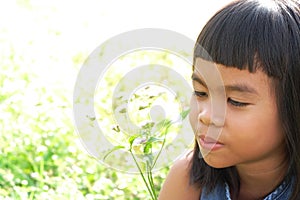 Asian girl in flowers field.