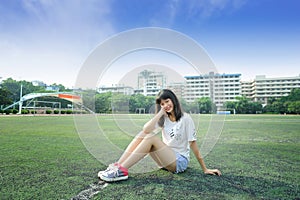 Asian girl in the football field of school photo
