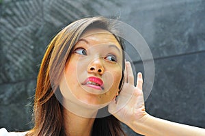 Asian Girl Hand Gesture - Hearing 1