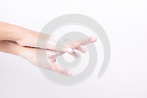 Asian girl hands are washing with soap bubbles on white background