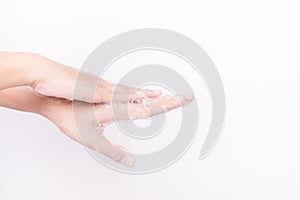 Asian girl hands are washing with soap bubbles on white background