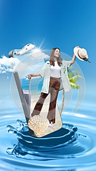 Asian girl in a hat standing with a suitcase on the beach with an ocean view on the mobile phone screen with a ferry and airplane