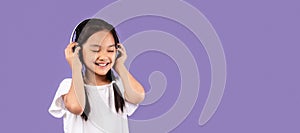 Asian Girl In Headphones Listening Music Standing In Studio, Panorama