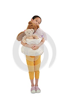 Asian girl kid hugging toys bag for donation. Child cuddle bag of dolls isolated on white background with Clipping path. Concept