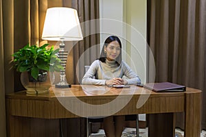 Asian girl like working woman, getting an interview on her desk