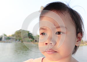 Asian girl, little toddler child with adorable short hair making frustrated face