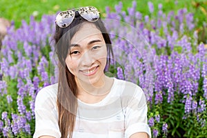 Asian girl long hair smiling outdoor with sunglasses