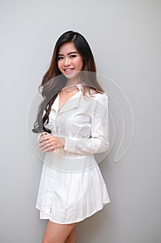 Asian girl with nice outfit, wearing a long sleeves dress