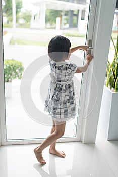 Asian girl opend door at home.