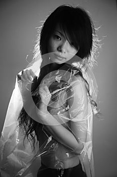Asian girl in a plastic bag
