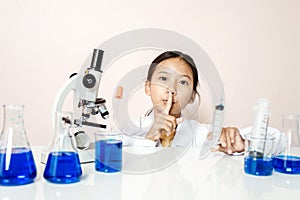 Asian girl playing as a scientist to experiment