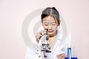 Asian girl playing as a scientist to experiment