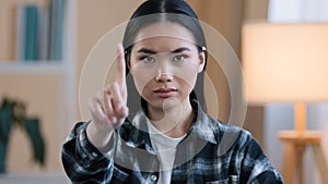 Asian girl portrait woman serious angry aggressive lady waving index finger negative no answer not sign ban forbiddance