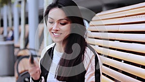 Asian girl with a pretty face sitting on a bench