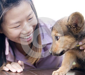 Asian girl and puppy