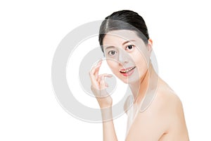 Asian girl put cream on her sunburnt nose.