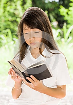 Asian girl reading book