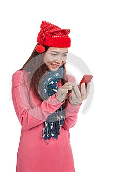 Asian girl with red christmas hat touch smart phone