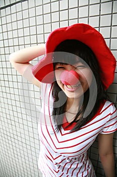 Asian girl with red nose and hat