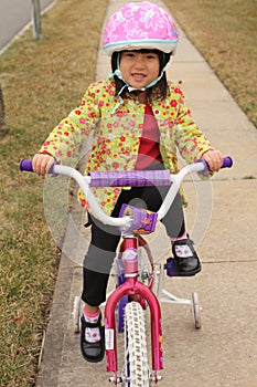 Asian Girl riding Bike