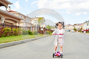 Asian Girl Riding Scooter