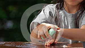 The Asian girl`s hand is rubbing the soap. To wash hands thoroughly with soap and water To kill germs that have spread from virus