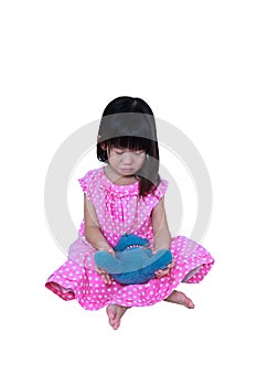 Asian girl sitting with toy bear, sadden and crying. Isolated on white background.