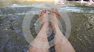 Asian Girl Sitting on the Waterfall Than Bok Khorani National Park in Krabi province, Thailand tourist landmark