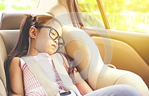 Girl sleeping in child car seat. photo