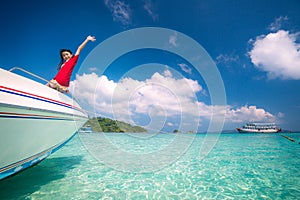 Asian girl on speed boat between sea travel trip