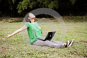 Asian girl stretches in the park