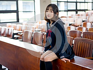 Asian girl student in school uniform Learning in the classroom