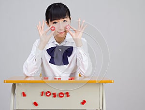 Asian girl student in school uniform math