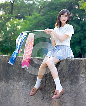 Asian girl student in school uniform outdoor