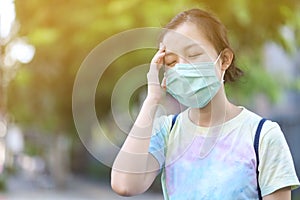 Asian girl with surgical mask felling dizziness