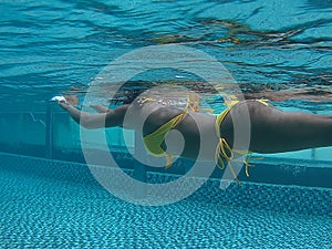 asian girl swim pass underwater photo shoot in pool