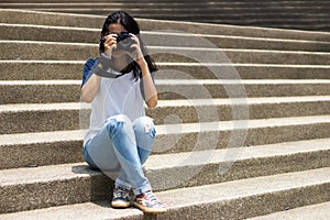 Asian girl take photo in city photo