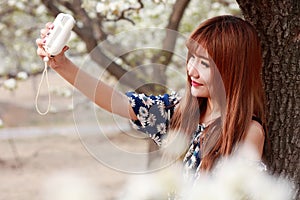 Asian girl taking pictures