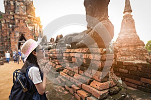 Asian girl traveler with respecting or pray