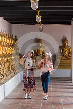 Asian girl traveler in thai temple