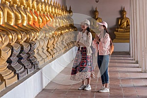 Asian girl traveler in thai temple