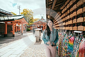 Asian girl traveler walking along praying wall