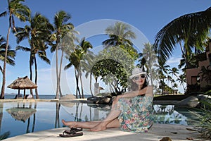 An asian girl at a tropical resort