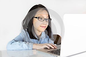 Asian girl is using a laptop on white background