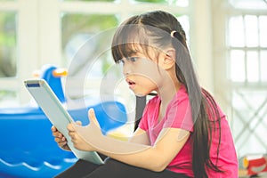 Asian girl using tablet , early education and learning