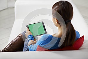 Asian girl using touch pad device