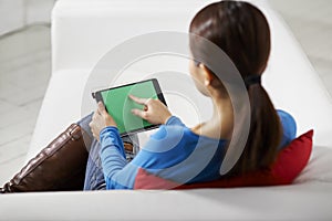 Asian girl using touch pad device