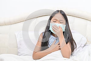 Asian girl wear hygienic mask is.coughing and chest pain