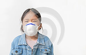 Asian  girl wear N95 mask to protect PM 2.5 dust and air pollution