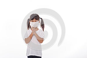 Asian girl wearing mask for protect pm2.5 and coronavirus Covid-19.Stay at home praying to GOD.Online church worship in sunday.